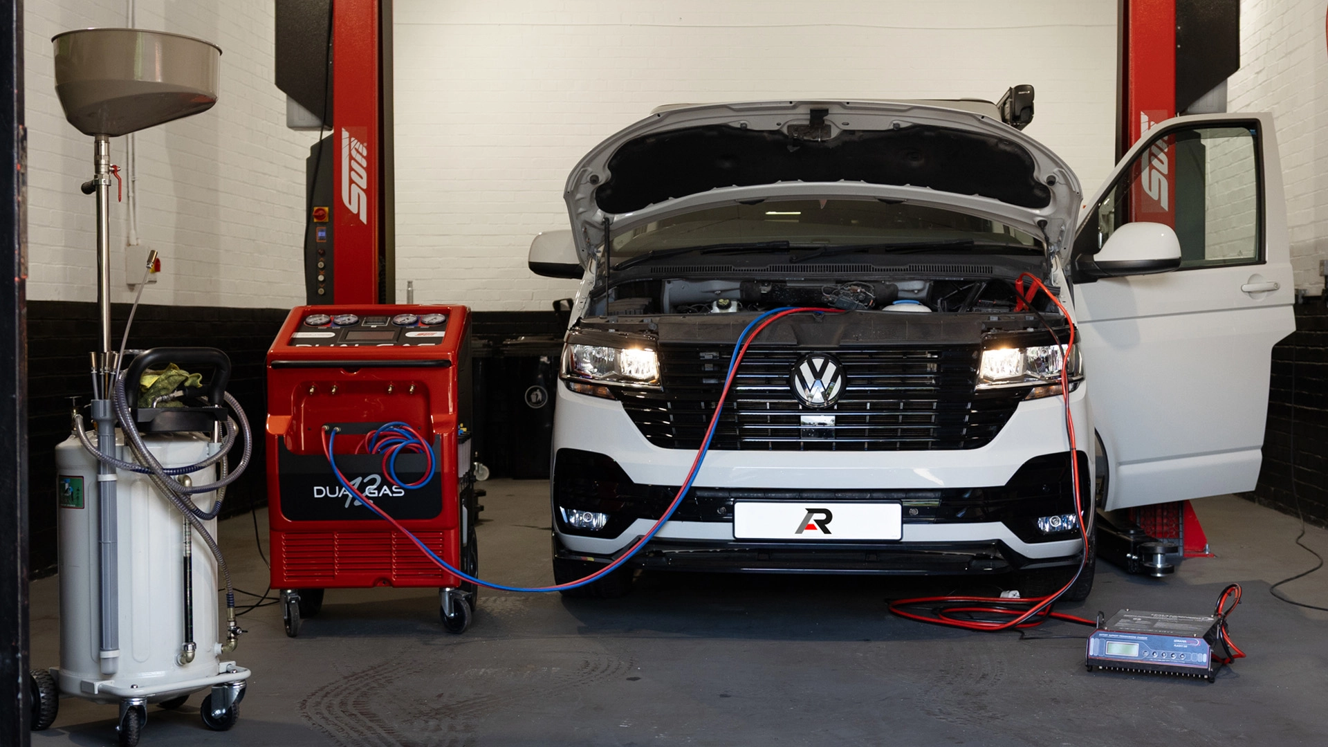 White VW van in the repair bay at AR Automotive